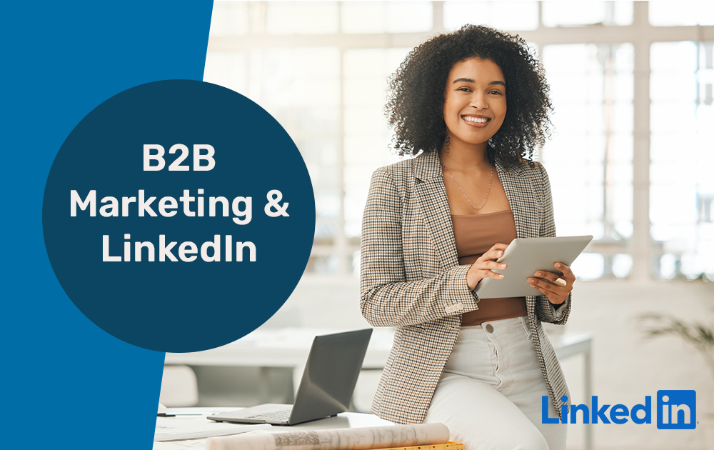 African American Girl In Corporate Attire Holding A Tablet Promoting LinkedIn B2B Marketing