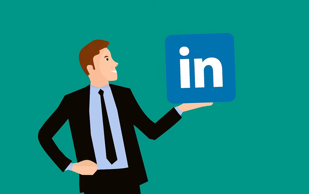 Animated Figure Of Man In Black Suit Holding LinkedIn Sign